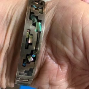 a bracelet from Mexico. It has very pretty inlaid stones that change colors.